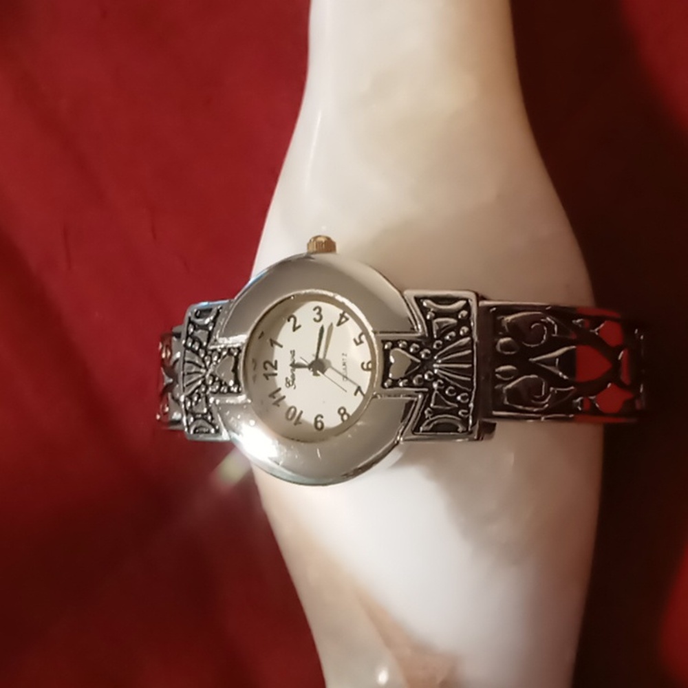 Geneva spring hinged bracelet watch stainless, silver & black accents.